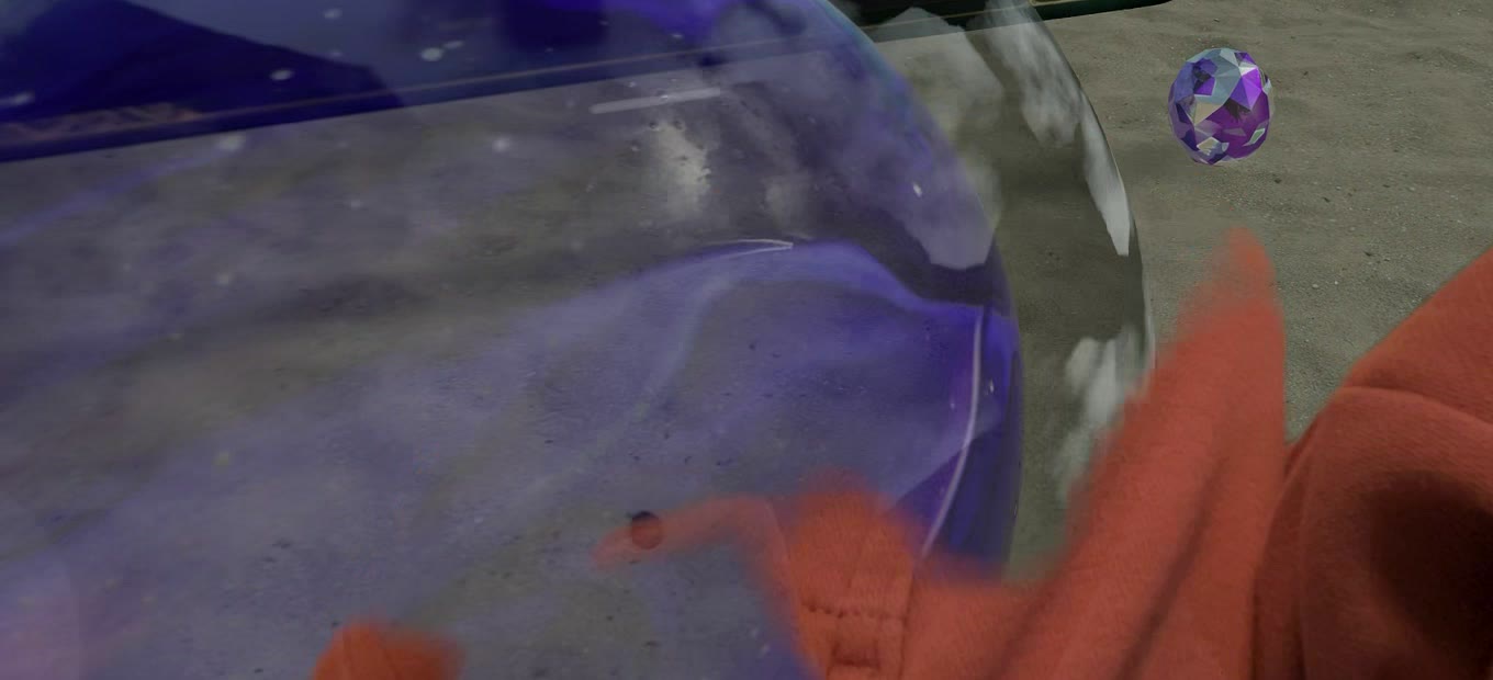 Hands holding a crystal ball controller in a Jambot prototype.